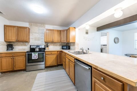 Culinary Haven! Kitchen boasts electrical appliances: garbage disposal, oven, stove, dishwasher, and microwave. Large fridge with filtered water & ice machine. Everything you need to whip up delicious meals!