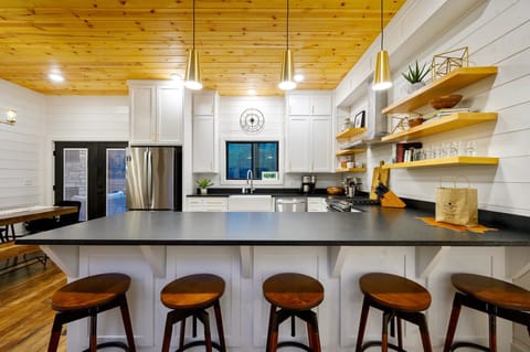 5 stools can be found at the bar top for additional seating.