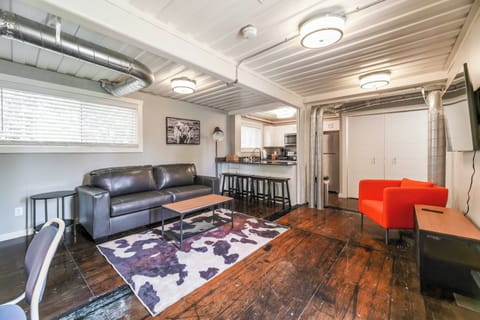 You enter right into the living area that includes a sleeper sofa and 55"Smart TV. Notice ample bar seating and the fully appointed kitchen