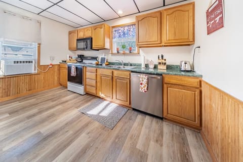 Large kitchen with stove, dishwasher, fridge and lots of cabinet space