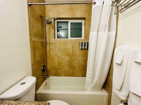 Combined shower/tub, hair dryer, towels, soap