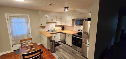 Dinning area and back deck door. Laundry to left and kitchen to right. 