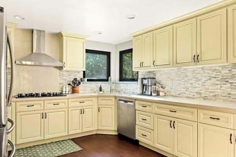 Indulge in culinary creativity with a 4-burner stove and all of the essential appliances. This modern kitchen is your canvas for preparing a feast for your loved ones!