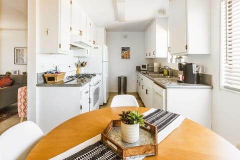Kitchen with utensils, dish ware, pots and pans, flatware provided