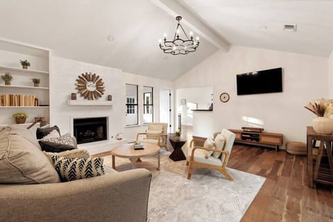 This cozy living room is the perfect place to hang out with family and friends. The comfortable couches and chairs provide a spot to kick back after a long day, while the coffee table keeps all of your favorite snacks within arm’s reach.