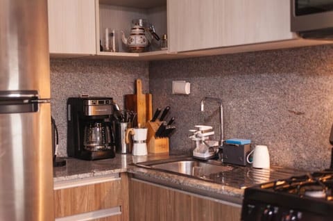 Fridge, microwave, coffee/tea maker, toaster