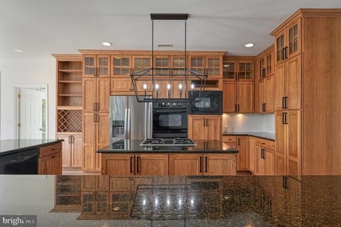 The kitchen is fully equipped and comfortable with 9 comfy stools for dining