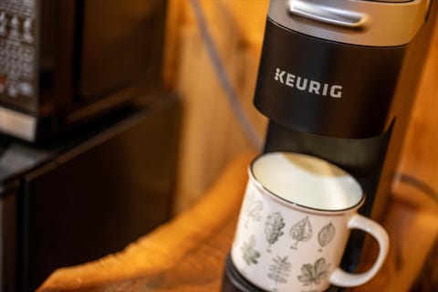 Fresh coffee brews ready as the family plans their fun day.