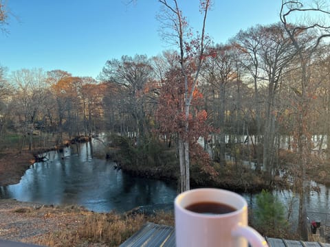 Step just outside the bedroom and enjoy a cup of coffee from the private upper level deck.