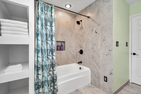 Combined shower/tub, hair dryer, towels, soap