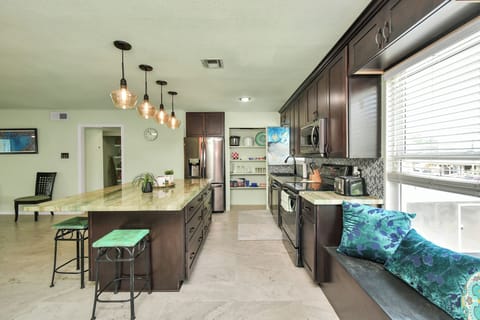 This kitchen is made for creating memories with loved ones. Plenty of seating.