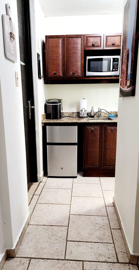 Fridge, microwave, stovetop, coffee/tea maker