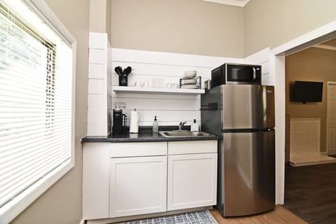 Fridge, microwave, stovetop, coffee/tea maker