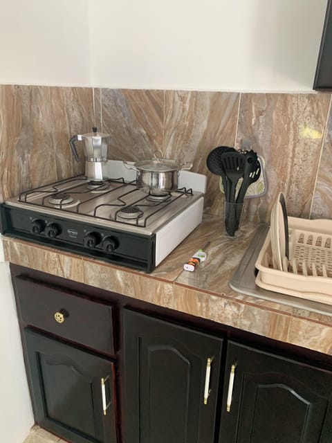 Fridge, microwave, stovetop, coffee/tea maker