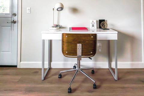 a dedicated work desk nestled inside the master bedroom