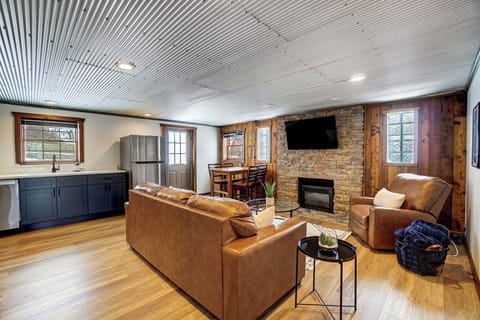 The cozy home features a dining area, electric fireplace and cable TV.