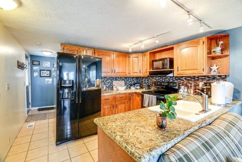 Kitchen. Door with keypad entry back left. Bathroom & laundry across from door.