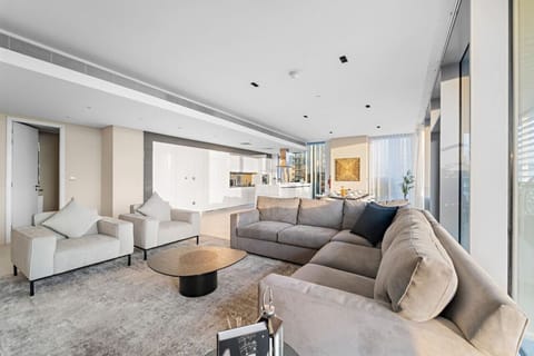 Living Room: Stylish elegance with plush seating and stunning views of Dubai`s skyline!