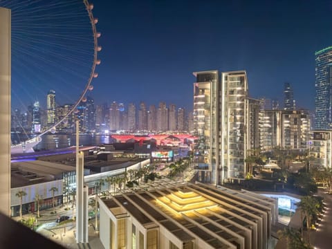 Skyline View: Marvel at breathtaking city views from your private balcony at night!