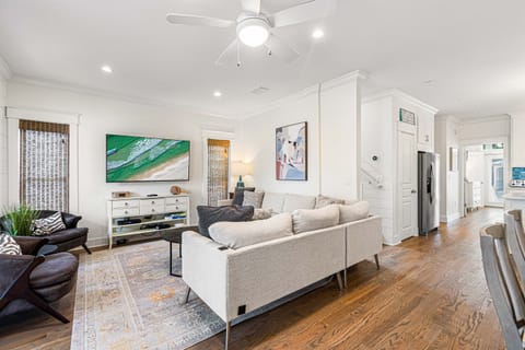 First Floor Living Room-Relax and recharge—literally! Our couch comes equipped with built-in USB ports, letting you unwind comfortably while keeping your devices charged for your convenience. There is also a tv, games and easy access to the front porch.