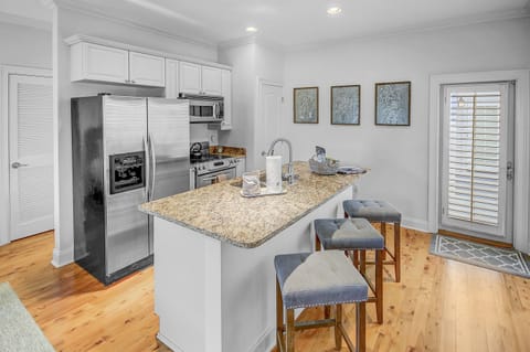 Welcome to our carriage house—a haven of convenience and comfort. This fully stocked kitchen is a culinary delight and includes seating for up to 3. Equipped with full size appliances, it's a complete setup for preparing delicious meals!