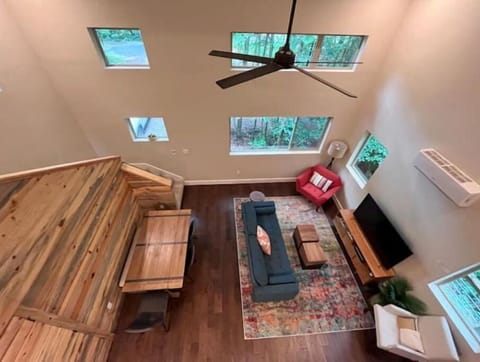 View of the main living and dining area of the home from the loft and workspace