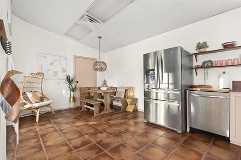 Combine dining and kitchen comfort in one welcoming space.