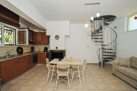 Our living space is designed for comfort and connection. Relax on the comfy sofa and come together around the dining table for shared moments and delightful meals.