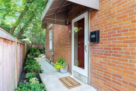 Entry from the street is through the wrought iron gate and to the front door.