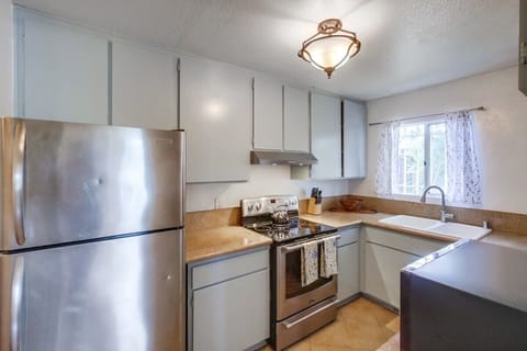 Full kitchen with refrigerator, dishwasher, Keurig, stove, and oven.