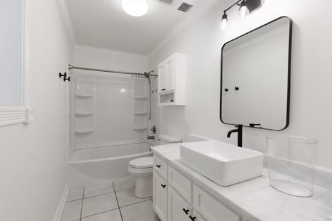 Combined shower/tub, hair dryer, towels, soap