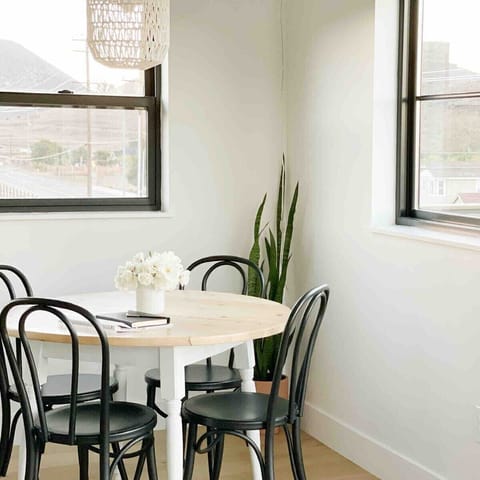 A dining nook that doubles as a home office during the day. That is if you can work without being too distracted by the views!