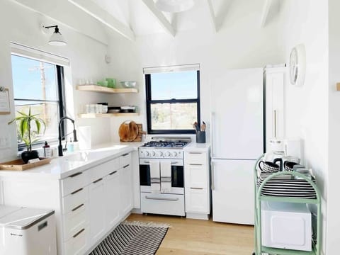 Save money by preparing your own meals in the kitchen! The market is just a mile away.