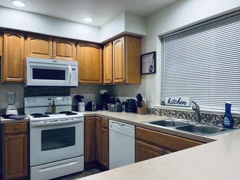 Kitchen fully stocked with utensils, pots, pans, toaster, blender, coffee, etc.