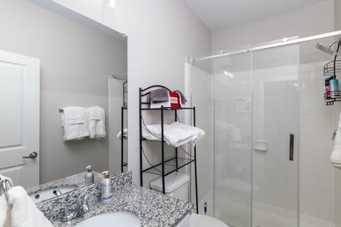 Combined shower/tub, hair dryer, towels, soap