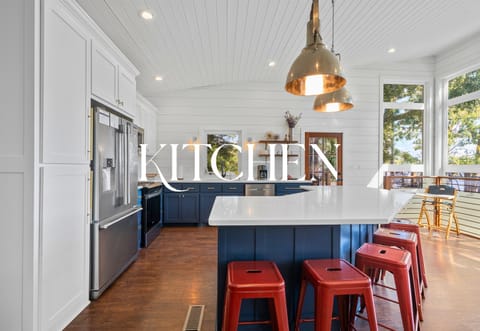The kitchen: bold blue cabinets, modern appliances, and plenty of space to create meals.