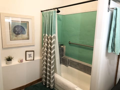 Combined shower/tub, hair dryer, towels, soap