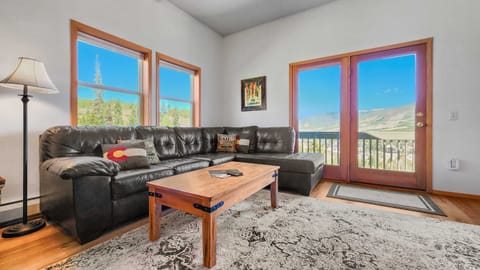 Enjoy beautiful views of Ptarmigan Mountain and Silverthorne from plush furnishings found in the inviting living room.