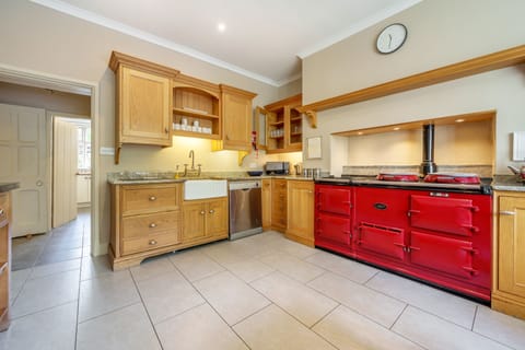 The kitchen is warmed by a 4 oven AGA.