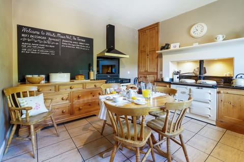 Kitchen with AGA and  dual fuel range cooker.