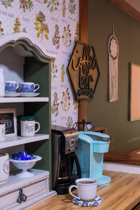 Coffee bar stocked with creamer, k-cups, tea, sugar, etc