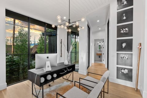 Finally, after walking through a glass hallway, to the office where connection to business life can be maintained. Access to printer if you need a quick print. WiFi Boosters thru out our home make access easy.