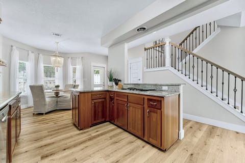 Fully Equipped Kitchen with views of the second floor stairs 