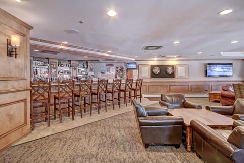 The lobby features a fully stocked bar and comfortable seating.