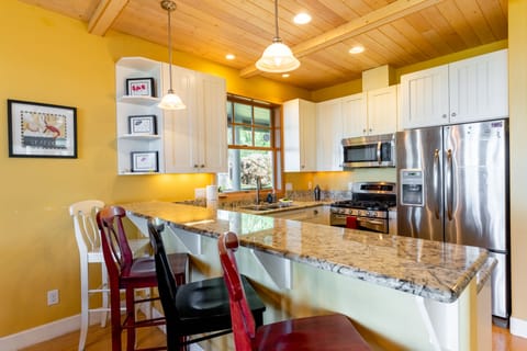 Sleek stainless steel appliances and stunning granite countertops