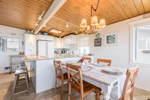 Seamless kitchen and dining, where culinary creations meet family gatherings.