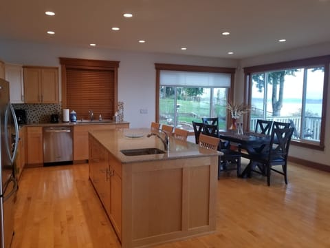 Where the kitchen island and dining area unite for culinary bliss.