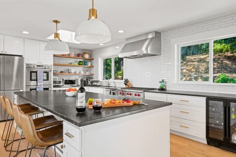 Enjoy a home cooked meal in this fully furnished kitchen. With a gas stove, coffee bar and small wine fridge, any culinary creation is possible!