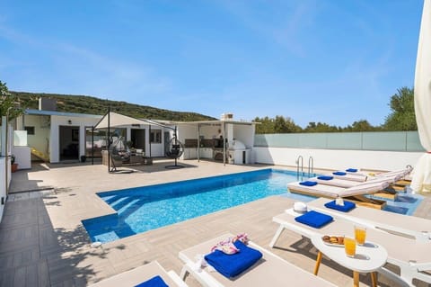 Relaxation in the pool area under the greek sun
