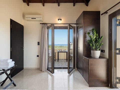 Lovely petite balcony with a view of the Cretan plains and the sea.